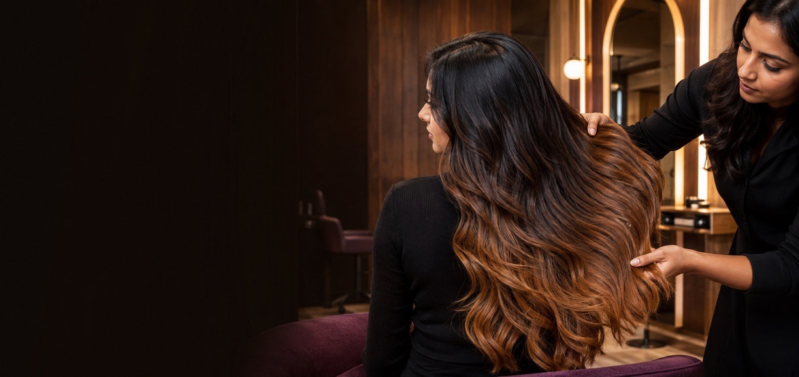 Indian client with a seamless dark-root to warm caramel ombre gradient