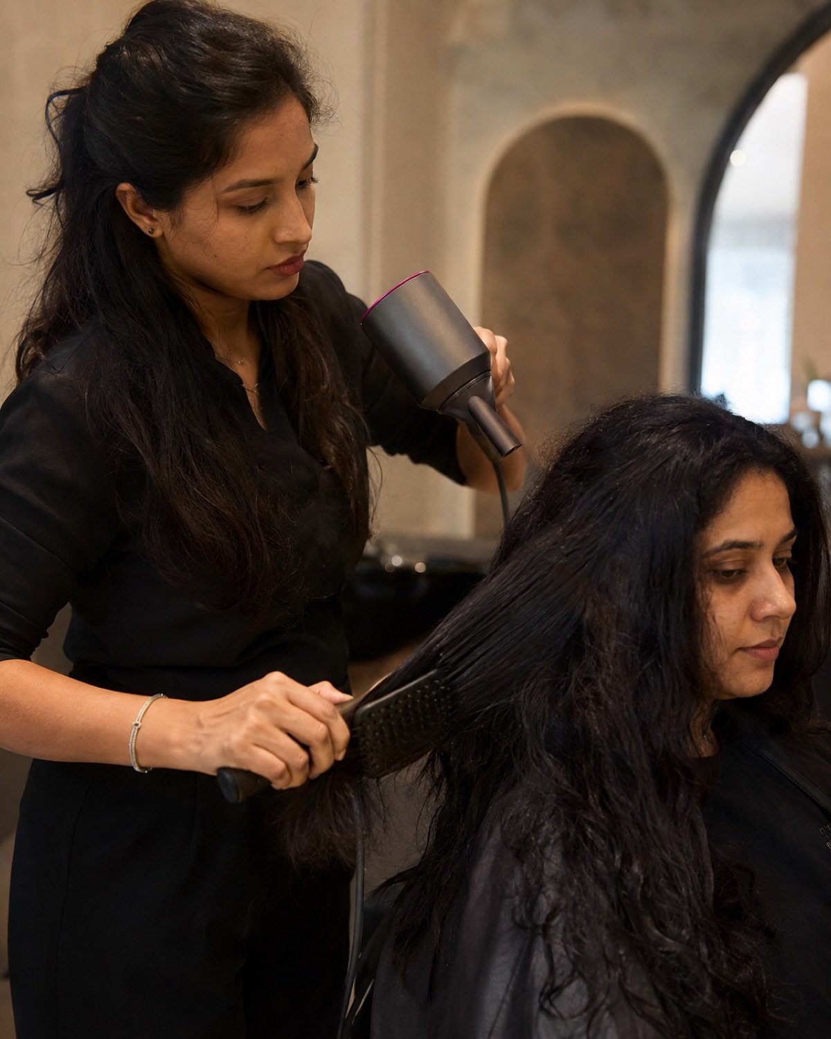 Controlled warm airflow sealing Protein Re-filler into naturally textured Indian hair