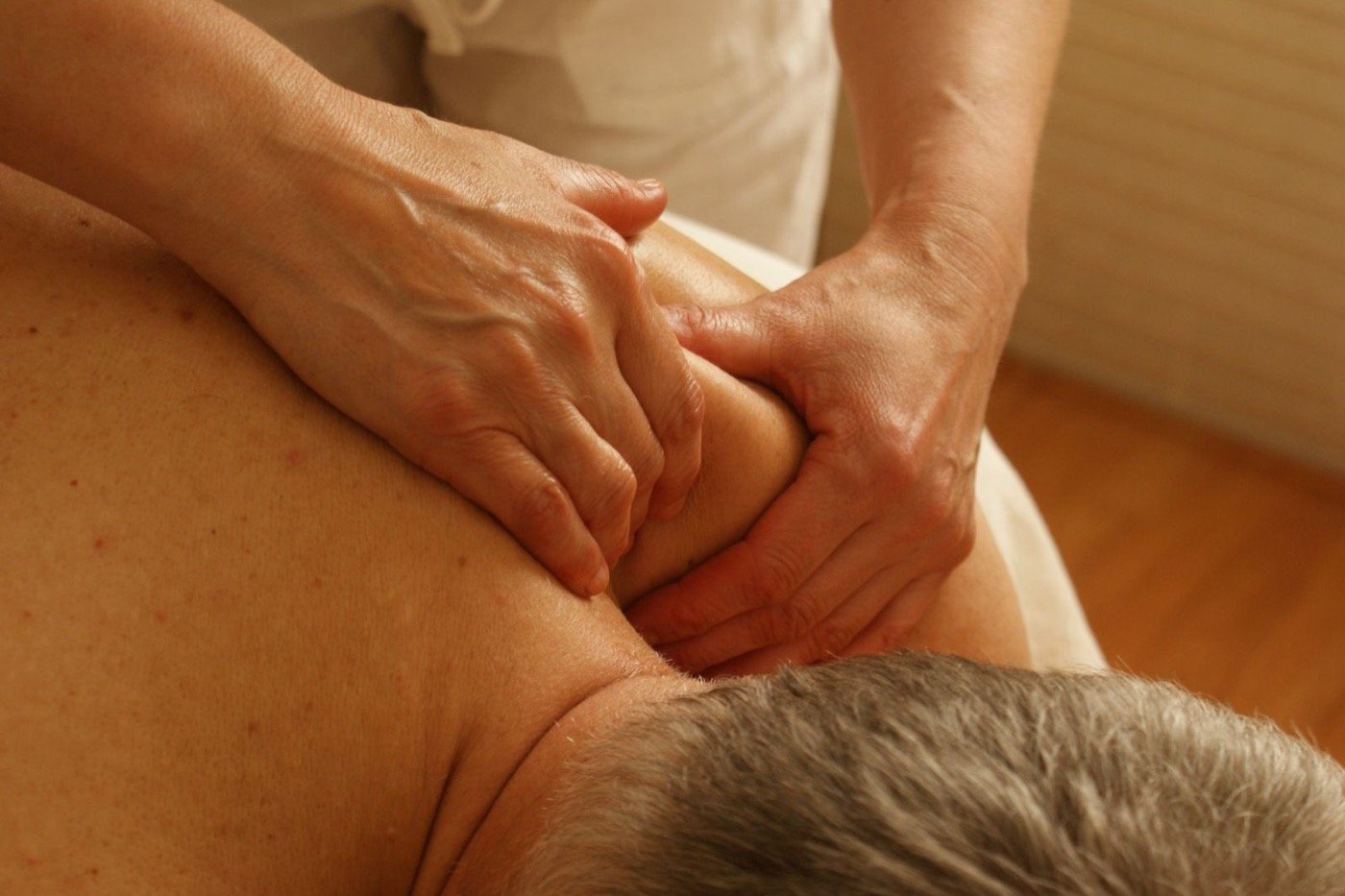 Targeted sports massage through the shoulder and neck at Plum & Sugar